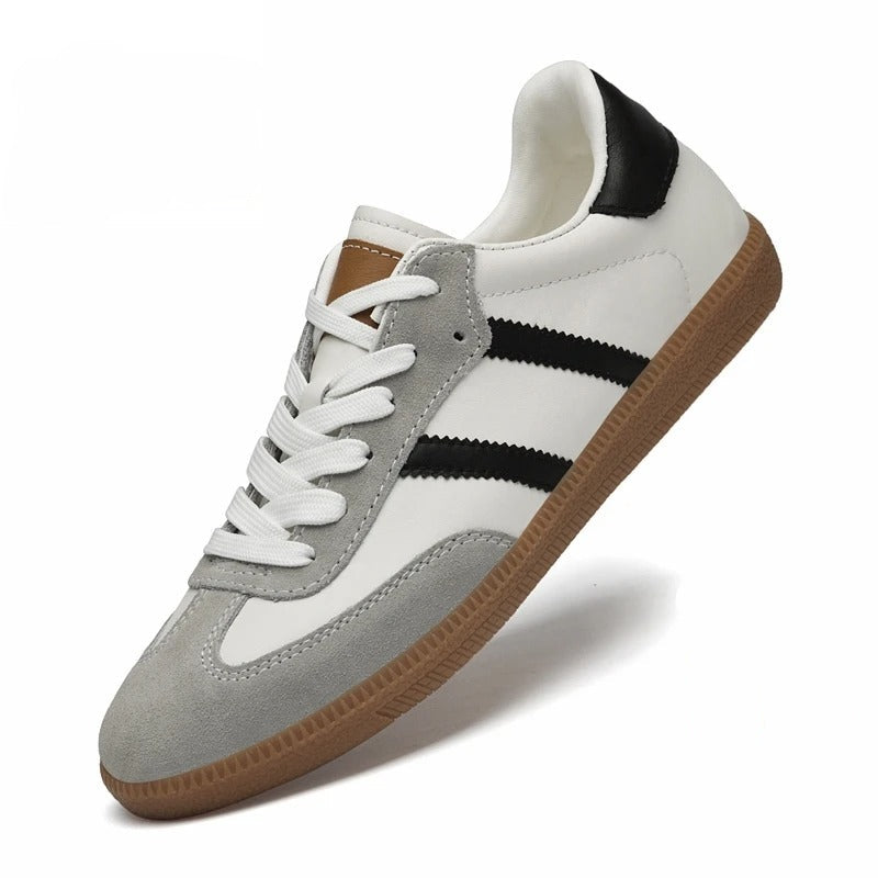 White and gray sneaker with black stripes on a white background, featuring height-increasing text.