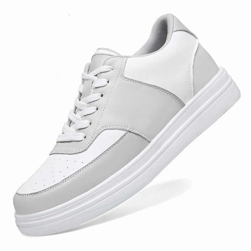 A white and light gray low-top sneaker shown on a white background, with a red circular callout reading '+ 6 CM' and a small before/after posture graphic in the lower right. The product itself is the shoe; the text and diagram are informational overlays rather than separate products.